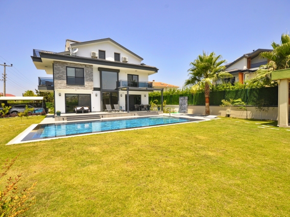 Experience the epitome of contemporary luxury living with this exceptional Premium Detached Triplex 4 Bedroom Villa in Koca Calis, Fethiye.