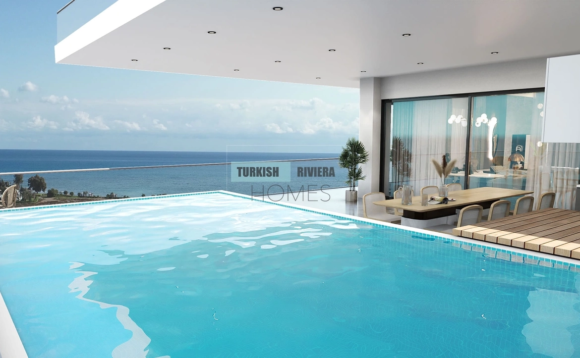 This Iskele development stands as Northern Cyprus's most ambitious luxury residential community — 686 units offering 180-degree Long Beach panoramas, an unmatched amenity portfolio spanning an Acqua Park, amphitheatre, and squash court, and residence options from studios to five-bedroom penthouses.